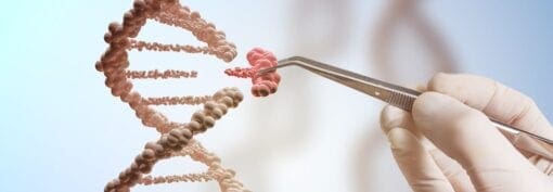 human hand removing gene piece from dna strand