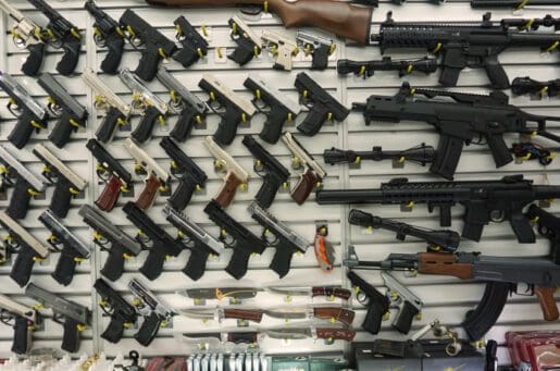 photo of a line of guns for sale