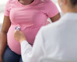 Black pregnant woman getting medical exam