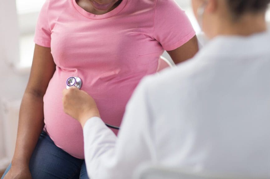 Black pregnant woman getting medical exam