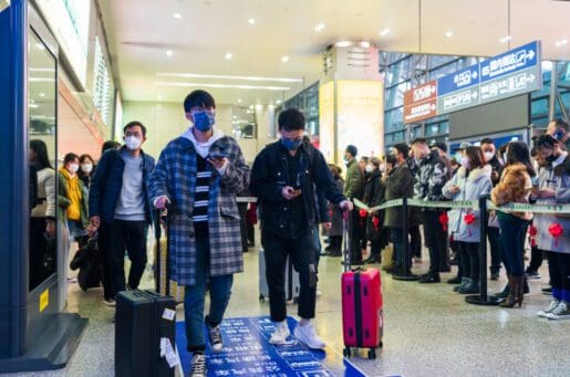 people with suitcases traveling in China