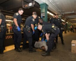 New York City police restraining homeless man