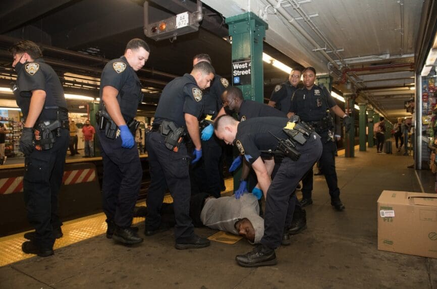 New York City police restraining homeless man