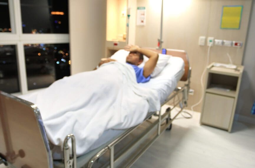 Black man in hospital bed