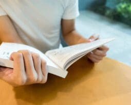 closeup of book being read at table