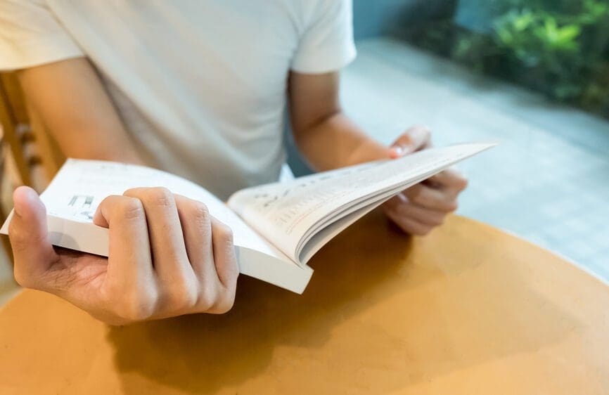 closeup of book being read at table