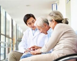 Asian patient and family in hospital