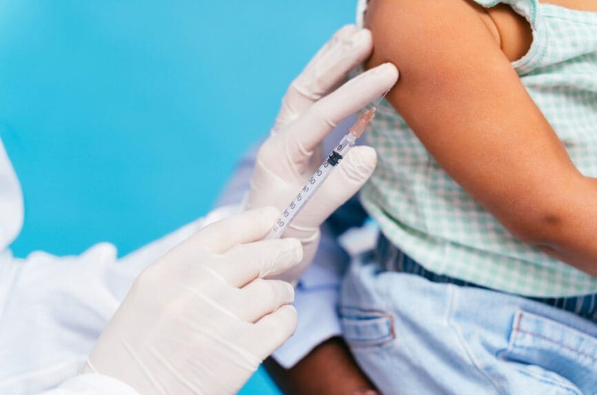 vaccine being injected into toddler's arm