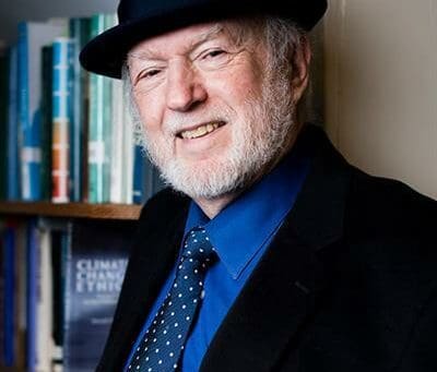 photo of an older bearded man with fedora